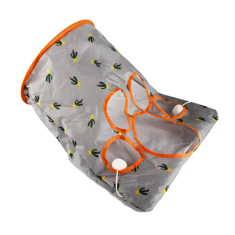 Couche grise et orange avec bordures orange, présentée dans Cat Play Tunnel - Durable Nylon Fun. Facile à ranger